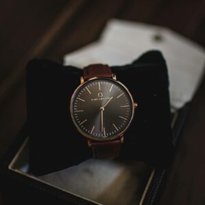 Close-up of a sophisticated brown leather watch presented in a stylish gift box, perfect for fashion and luxury themes.