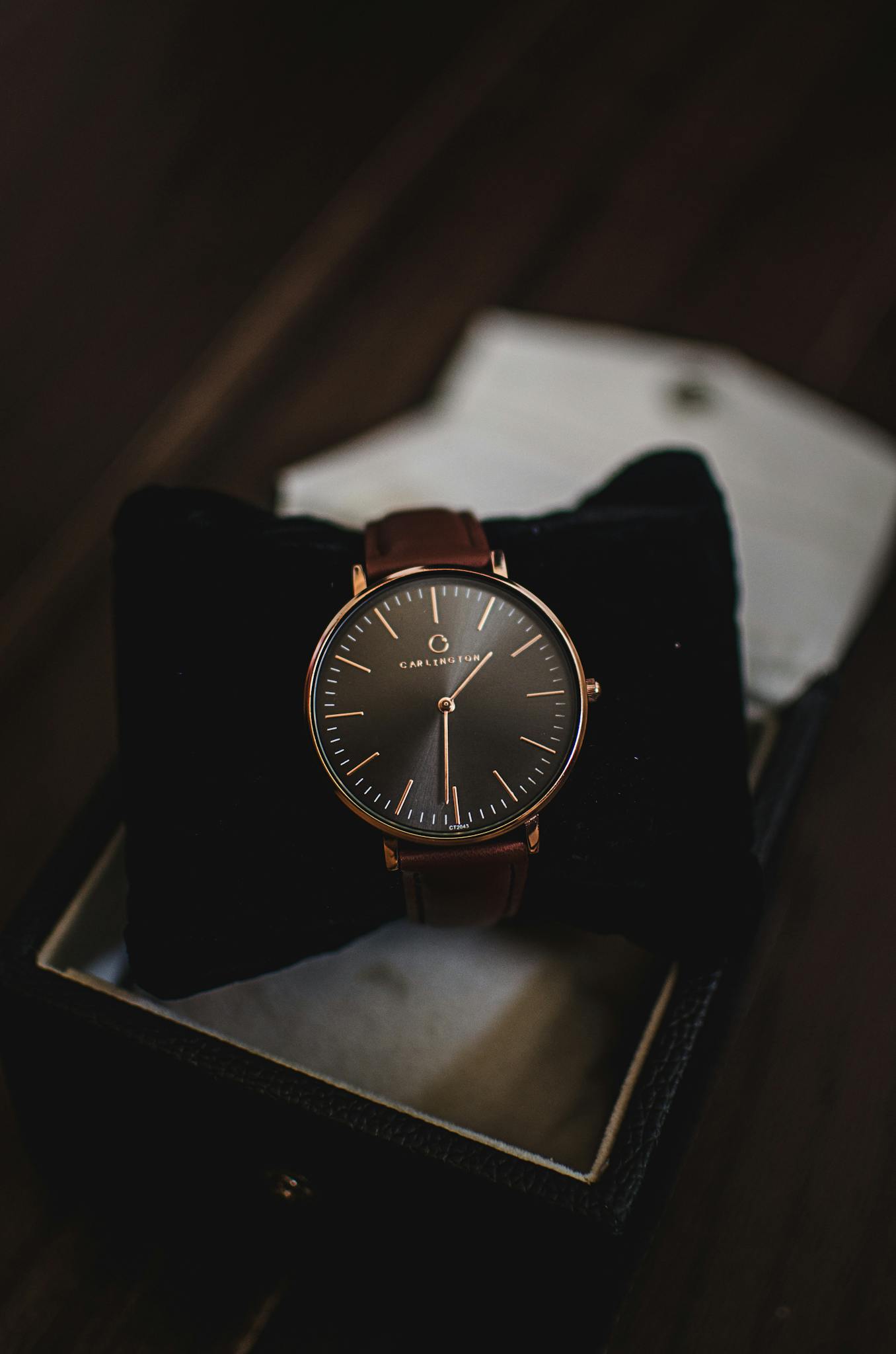 Close-up of a sophisticated brown leather watch presented in a stylish gift box, perfect for fashion and luxury themes.